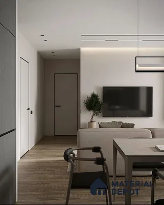 A kitchen with marble counter tops and stainless steel appliances on the wall, along with hanging lights hanging from the ceiling over the ceiling in front of a wooden counter top of a dining room table next to a
